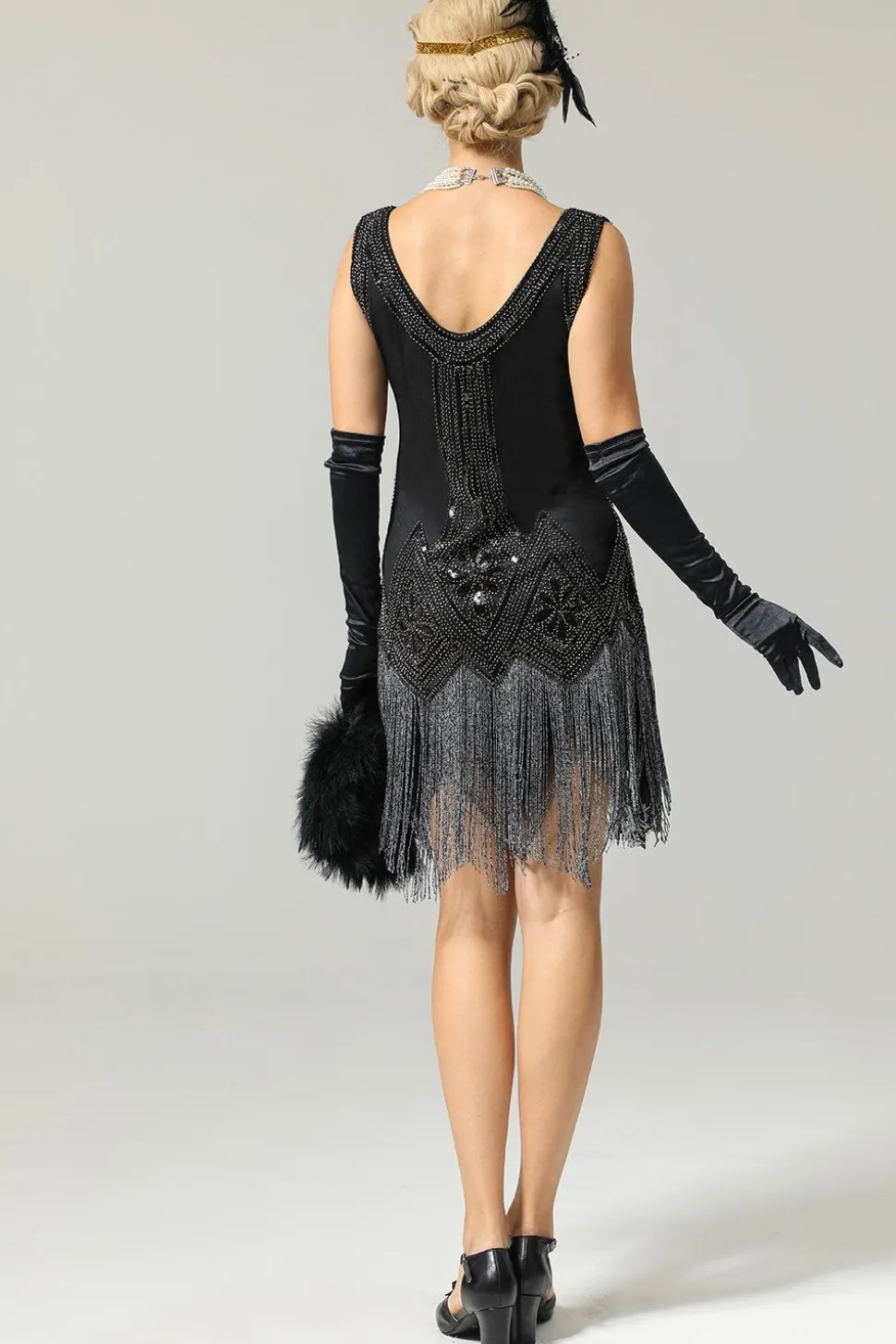 Preto vestido de flapper de lantejoulas dos anos 1920