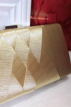 Saco de embreagem de noite glitter dourado com borla