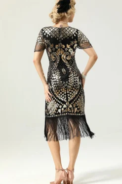 Vestido preto e dourado de 1920 com mangas de batwing