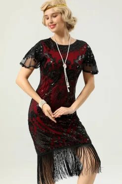 Vestido preto e dourado de 1920 com mangas de batwing