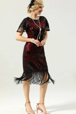 Vestido preto e dourado de 1920 com mangas de batwing