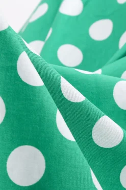 Vestido vintage verde ponto branco com mangas curtas