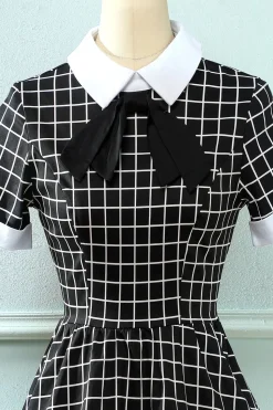 Vestido vintage xadrez de 1950 com arco